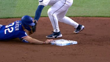 Evan Carter steals second after review