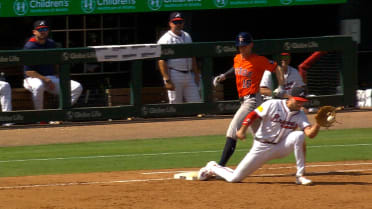 Zach Cole is safe at first base after a review 