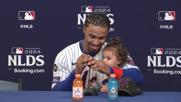 Amapola Lindor joins her dad after the game