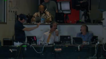 Paul O'Neill catches a foul ball in the booth