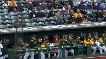 Mark Kotsay catches foul ball in the dugout