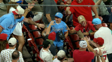 Ranger's fan catches Jake Burger's foul ball