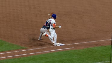 Jared Young safe at first base after replay review