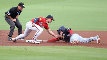 Dylan Crews ruled safe at second after challenge