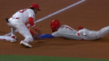 Zach Neto nabs Trea Turner at third after review