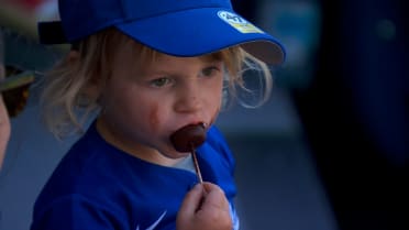 Fan throws foul ball back and enjoys some ice cream
