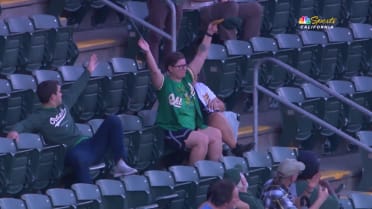 A's fan uses hat to catch foul ball