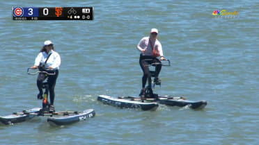 Giants fans paddle in the bay during the game