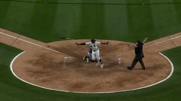 Tommy Pham scores on a play at the plate