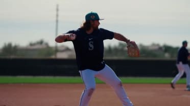 Brendan Donovan takes infield reps, swings at camp