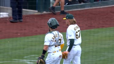 Athletics turn clutch double play in extras