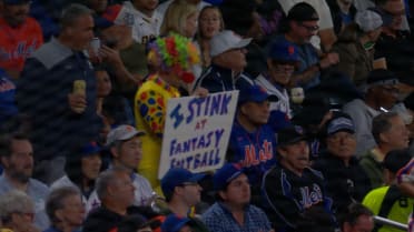 Fan wearing a clown costume is spotted in the stands