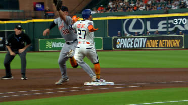 Jose Altuve safe at first after review