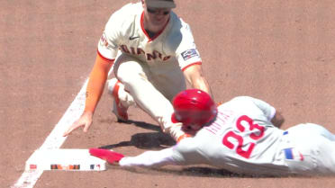 Johan Rojas is safe at third base after review