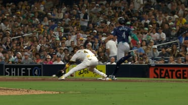 Josh Rojas is safe at first after review