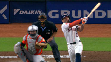 Jose Altuve homers following an umpire review