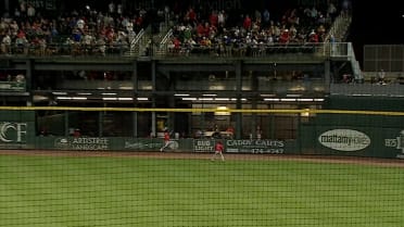 Tyler McDonough makes a crashing catch into the wall