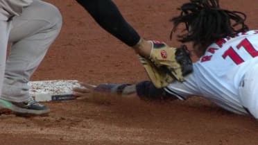 José Ramírez is safe at second after a review