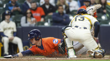 Zach Dezenzo is safe at the plate after review