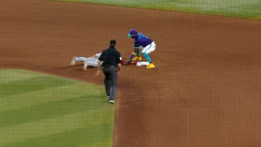 José Tena safe on pickoff attempt after review