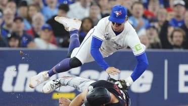Kirk throws out Wallner at third base after review