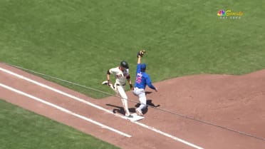 Austin Slater is safe at first base after a review