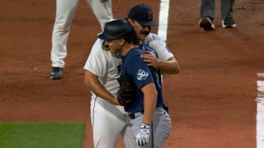 Payton Tolle tags Dominic Canzone with a hug