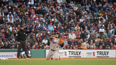 Isaac Paredes throws from his knees for the out