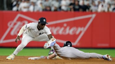 Trevor Story steals second after review
