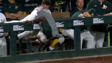 Lawrence Butler's athletic snag from the dugout