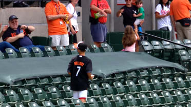 A young Orioles fan makes a nice catch on a foul ball