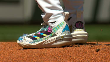 Bryan Woo receives cleats from Children's Hospital