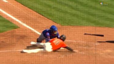 Jake Burger cuts down Isaiah Barkett at home plate