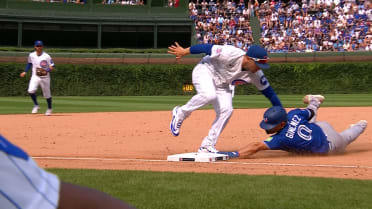 Andrés Giménez steals third base after review