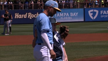 Ella throws out the first pitch to Brandon Lowe