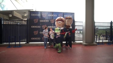 Bat Boys take photo with mascots