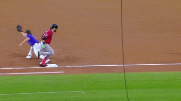 Eugenio Suárez hits an infield single after a review