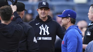 Bret and Aaron Boone exchange lineup cards pregame
