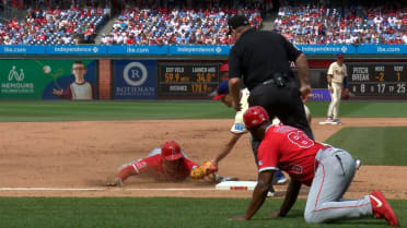 Mike Trout is safe at third base after review