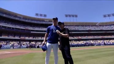 Ke Huy Kwan throws out the first pitch