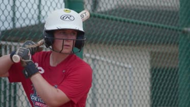 Softball and Girls Baseball Players switch at EDI