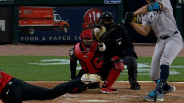 Stanton reaches on catcher interference after review