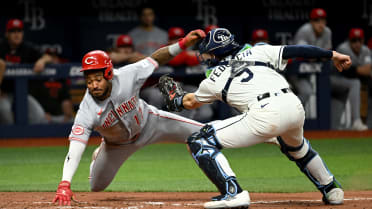 Dane Myers avoids tag with acrobatic slide into home