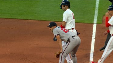 Masataka Yoshida scores on a fielding error by Olson