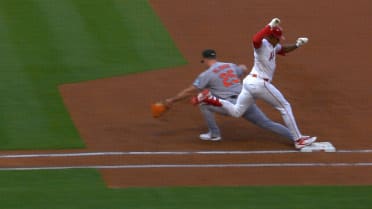 Christian Moore is safe at first after challenge