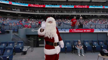 Santa Claus throws the first pitch