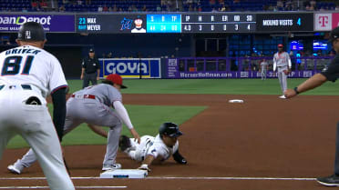 Javier Sanoja safe at first after Reds' challenge