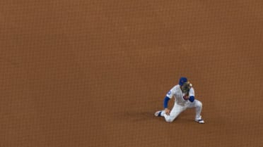 Michael Busch gets the out with ball stuck in glove