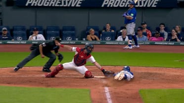 Carlos Santana cuts down runner at home after review