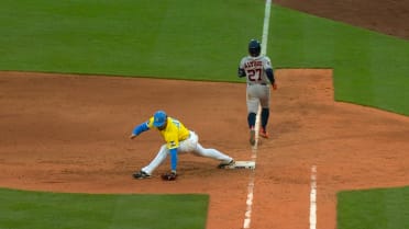 Jose Altuve safe at first after a review